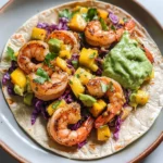 Spicy Shrimp Tacos with Mango Slaw and Avocado Crema